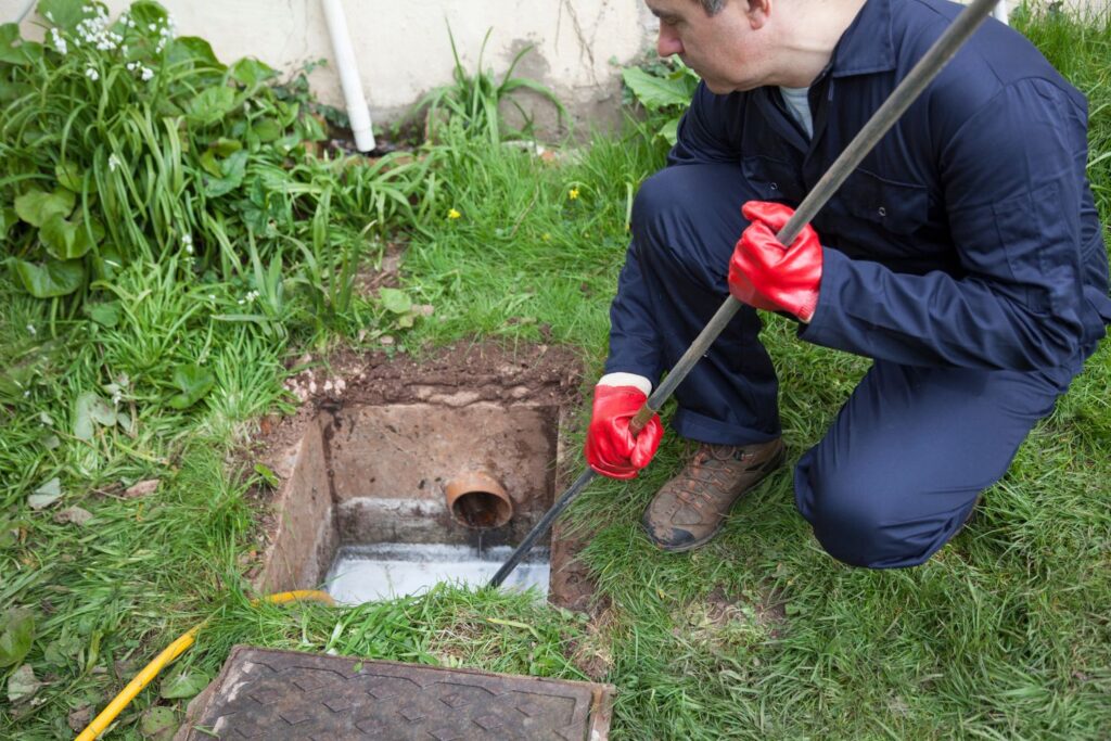 Man holding a sewer jetting service