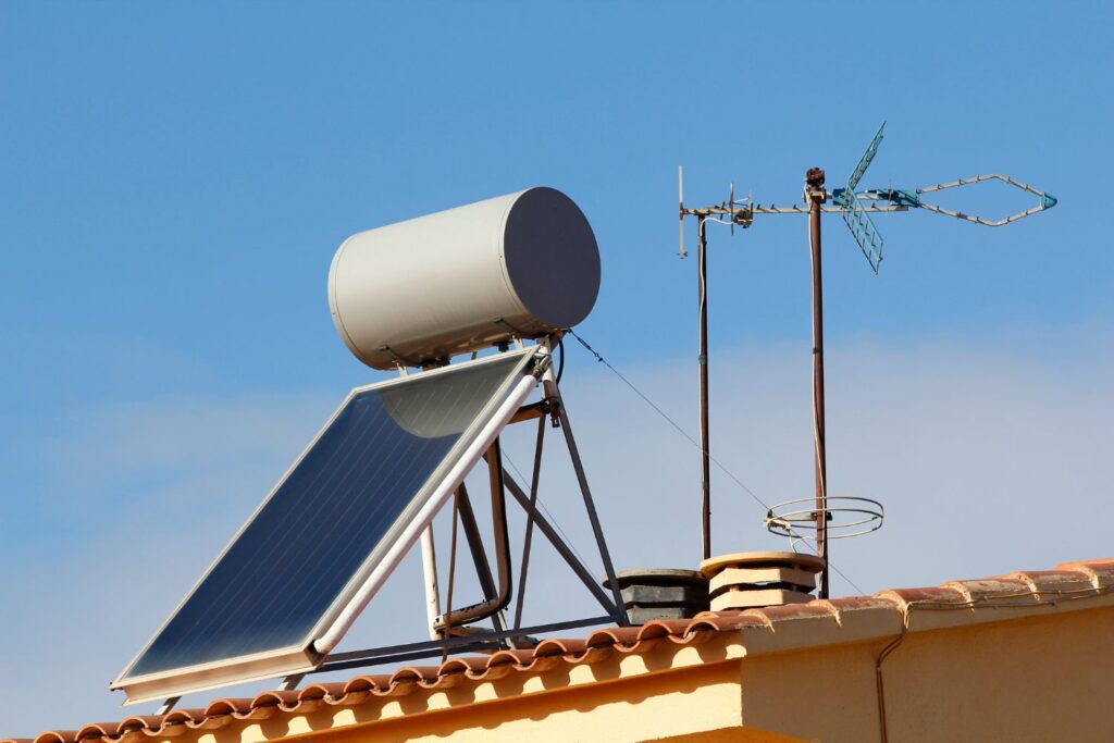 Solar water heating system and antenna on clay roof