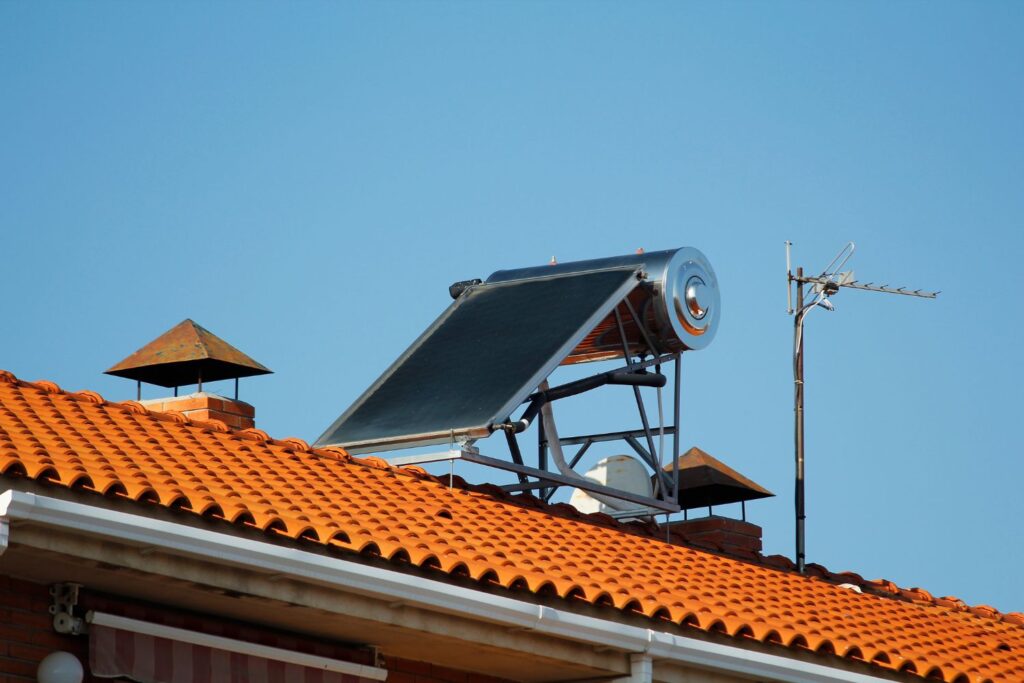 Solar water heating system on clay roof with antenna